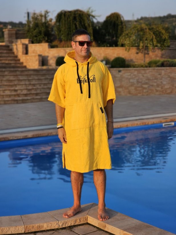 Surf Poncho BejkRoll WAVE MASTER - yellow - man standing by the pool - size L