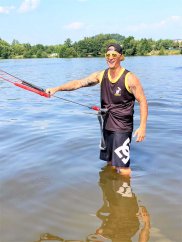 Sports functional kiteboarding Tank Top BejkRoll black yellow - personalised - in water with bar