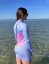 Ladies wetsuit BejkRoll Pastel Rainbow - girl in water side - size M