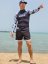 Board Shorts BejkRoll - OUTLINE 3/4 - light blue black & black rashguard - unisex - on the beach - front